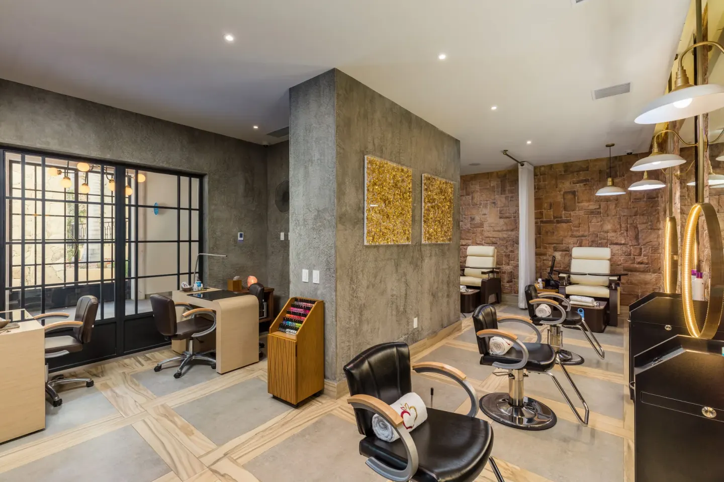 Salon chairs and manicure stations in the spa at El Encanto at Hacienda Encantada.