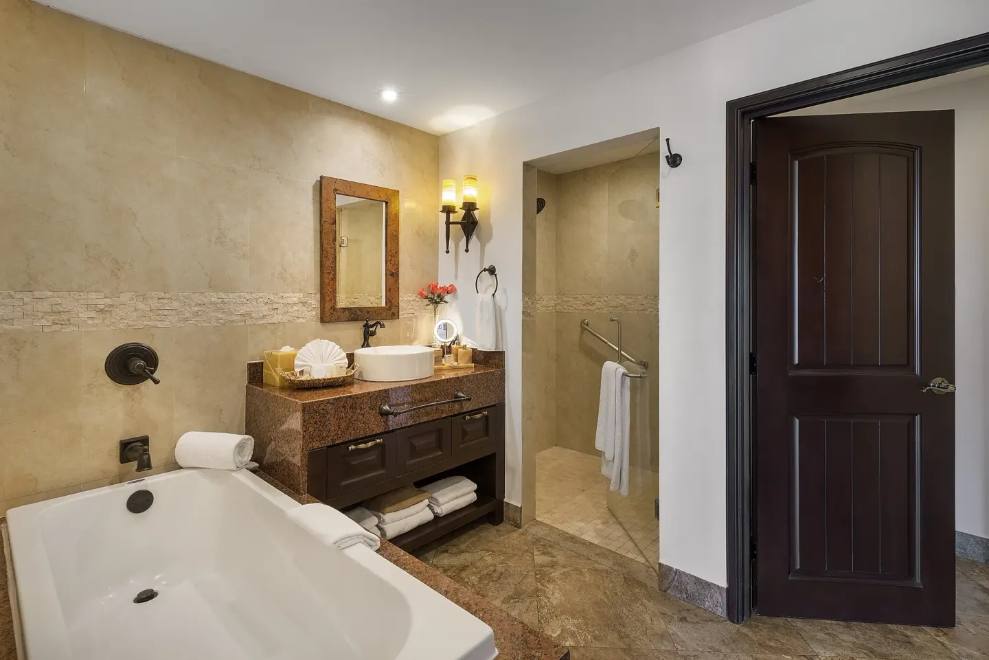 Luxury Suite bathroom at El Encanto at Hacienda Encantada with soaking tub, vanity, and shower.