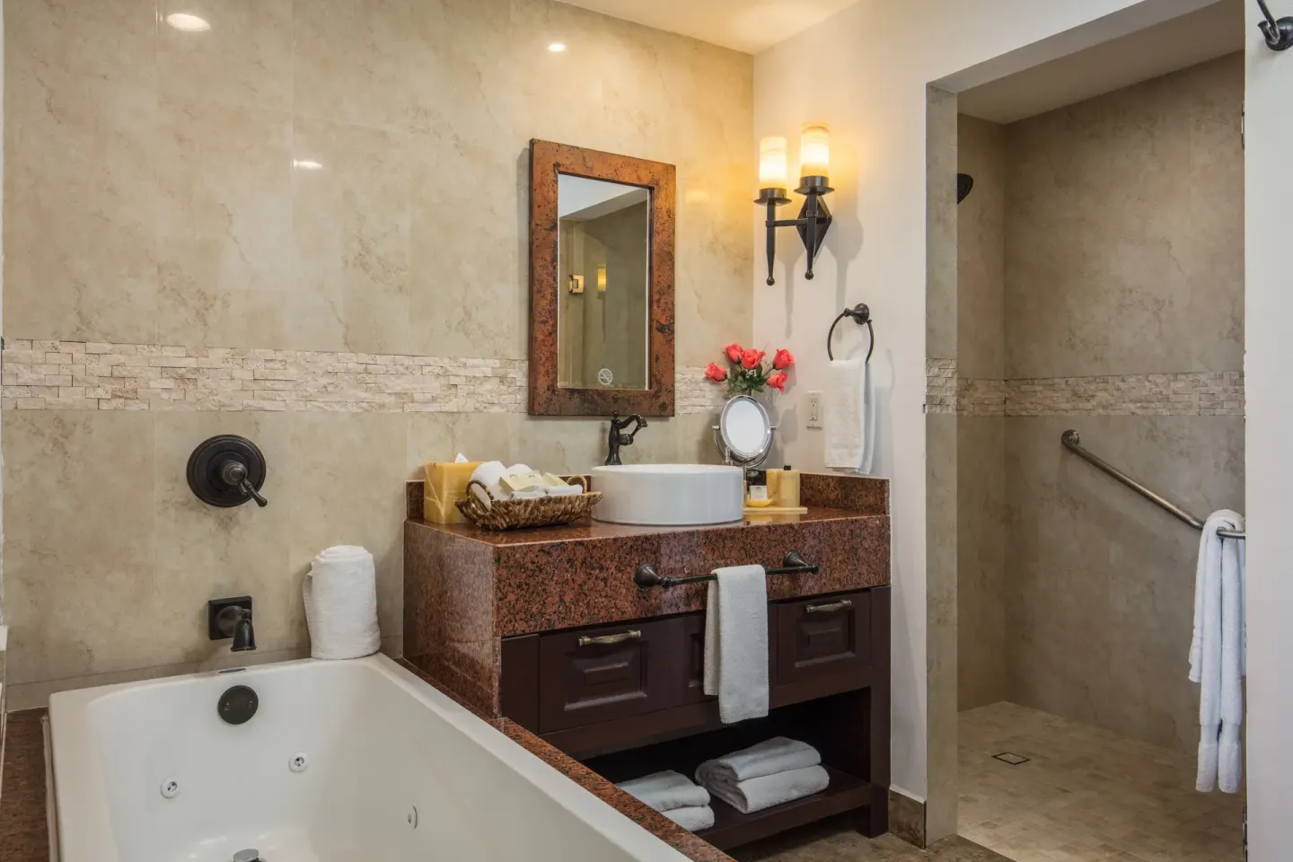 Luxury Suite bathroom with tub, vanity and walk-in shower at El Encanto at Hacienda Encantada.
