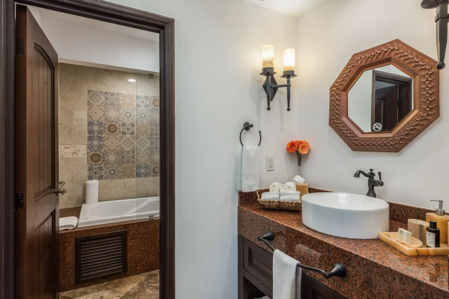 Luxury Suite bathroom at El Encanto at Hacienda Encantada with vessel sink and bathtub beyond.
