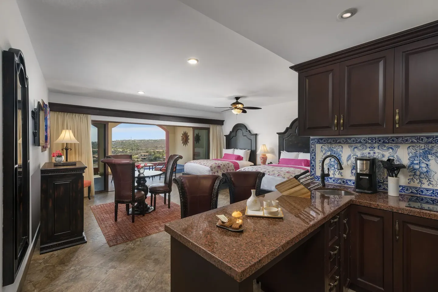 Luxury Suite two-bed room with kitchenette and balcony view at El Encanto at Hacienda Encantada.