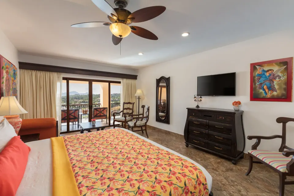 Premium Suite king bedroom with balcony seating at El Encanto at Hacienda Encantada.