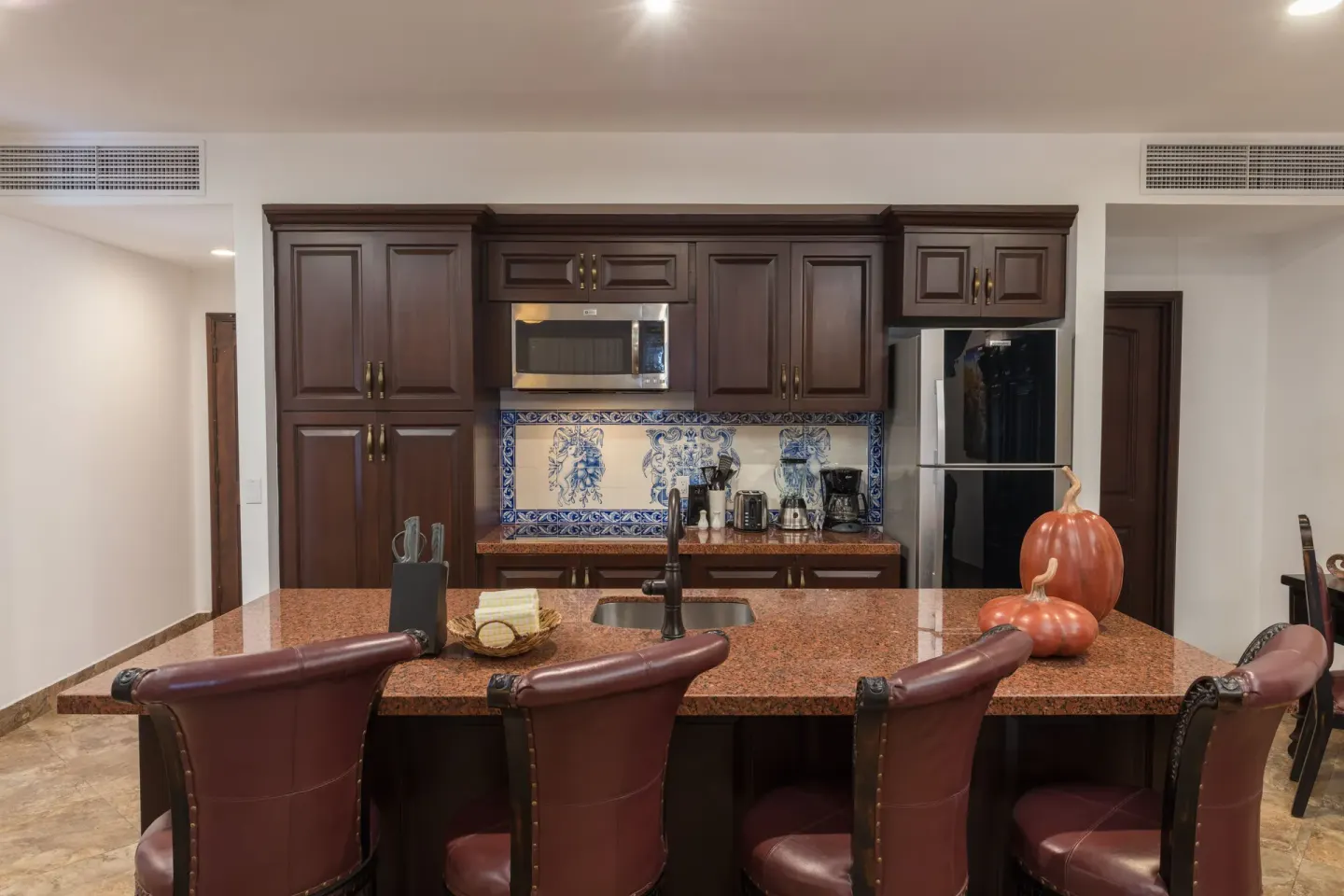 Premium Suite kitchen island with bar seating at El Encanto at Hacienda Encantada.