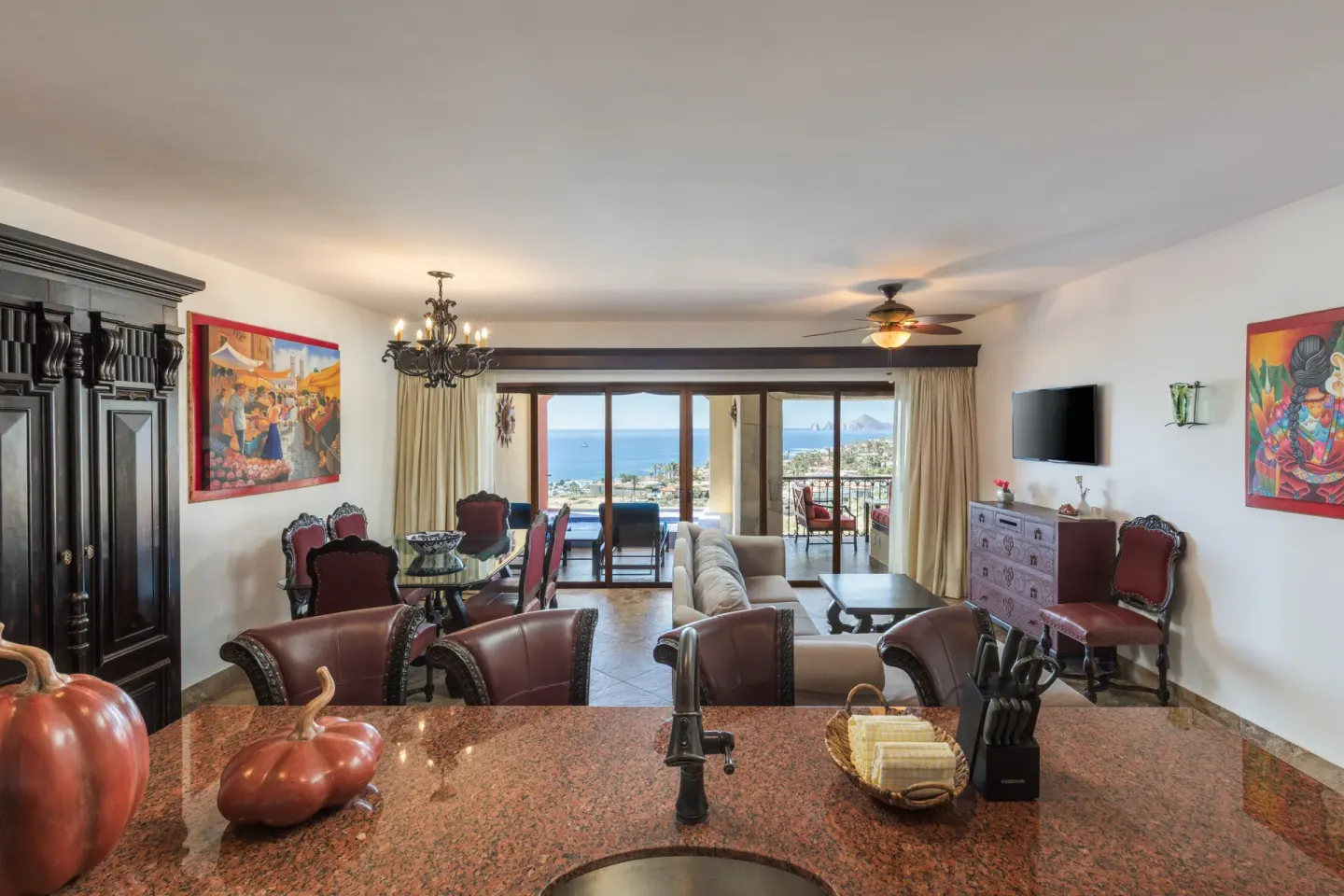 Premium Suite living and dining area with ocean-facing balcony at El Encanto at Hacienda Encantada.