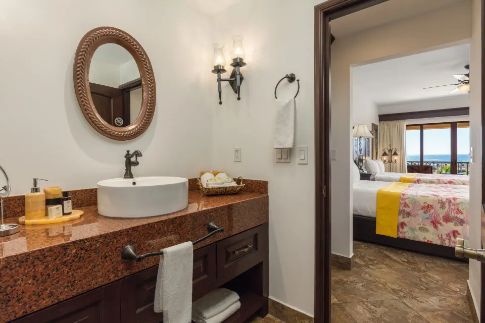 Studio Garden View bathroom vanity looking into the bedroom at El Encanto at Hacienda Encantada.