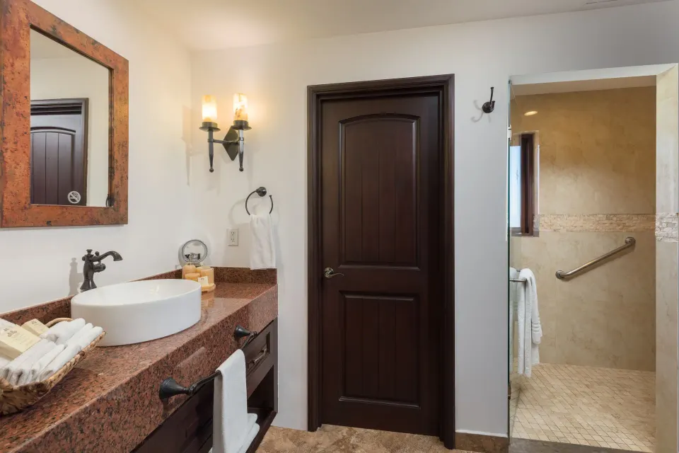 Studio Garden View bathroom vanity and walk-in shower at El Encanto at Hacienda Encantada.