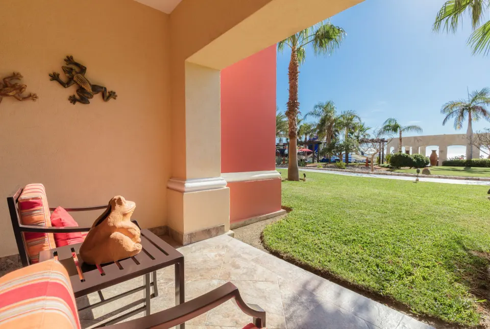 Studio Garden View patio with chairs and lawn at El Encanto at Hacienda Encantada.