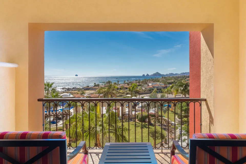 Studio ocean view balcony framed by railings at El Encanto at Hacienda Encantada.