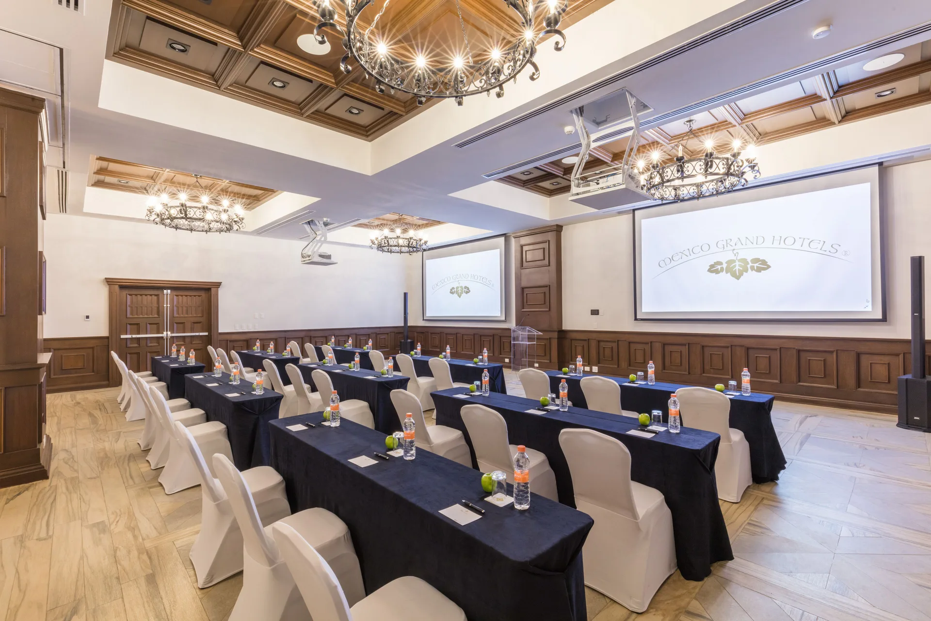 Classroom meeting setup with projection screens at El Encanto at Hacienda Encantada.