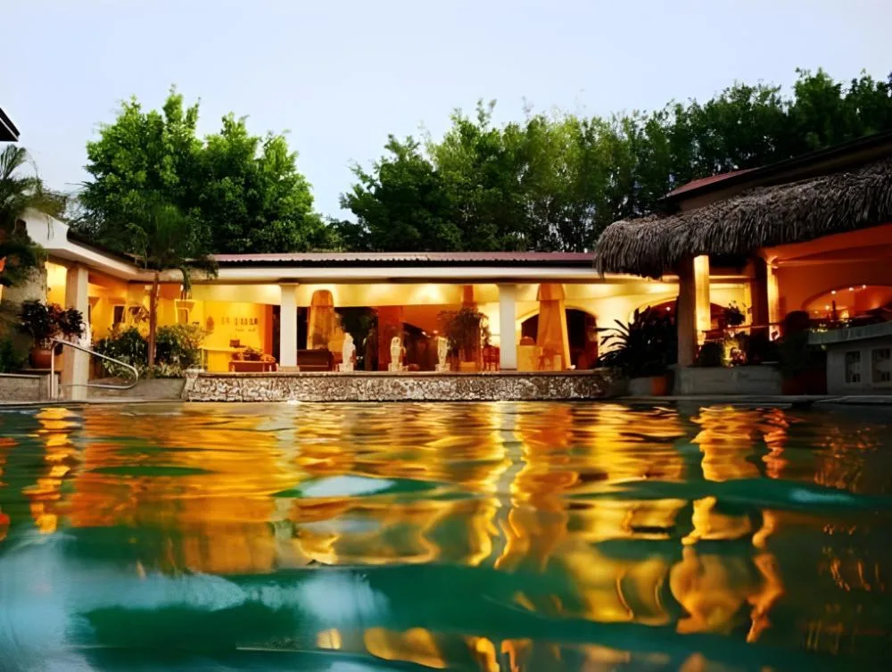 Hotel Tamarindo Diria Beach Resort established beachfront resort with oceanfront gardens and pool area in Tamarindo, Costa Rica.