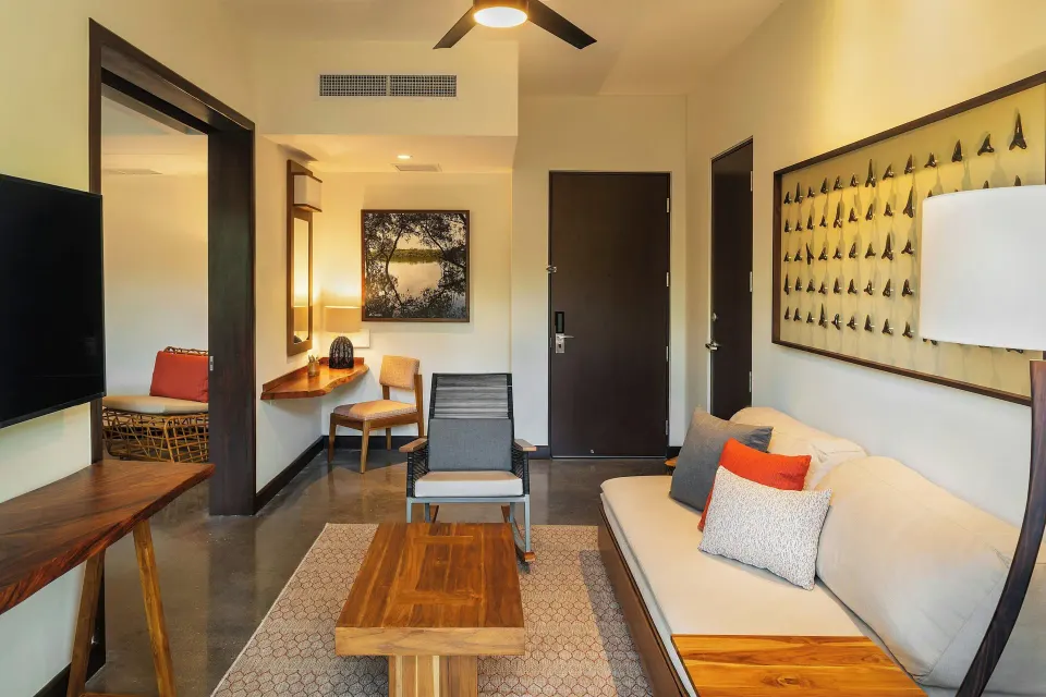 Living area with TV, desk and entrance at El Mangroove Papagayo