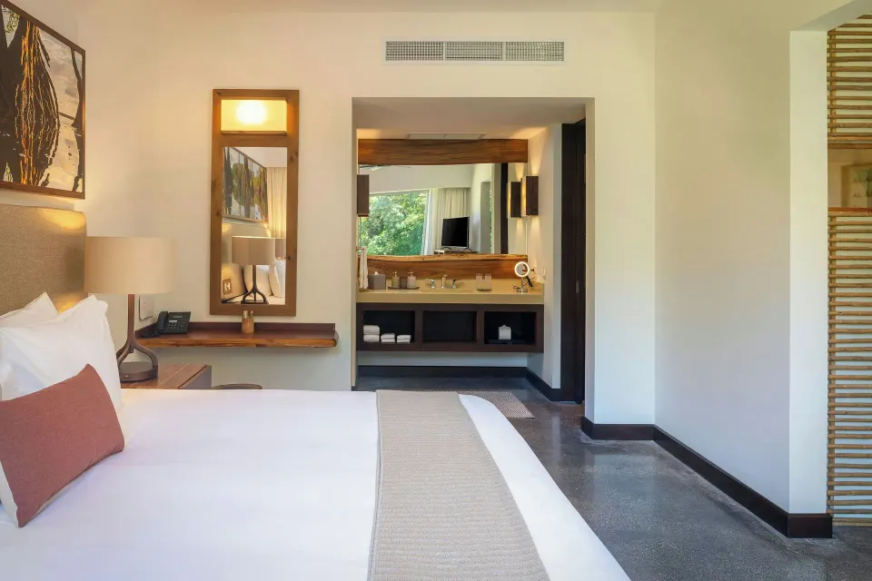 Guest room view toward sink and vanity area at El Mangroove Papagayo
