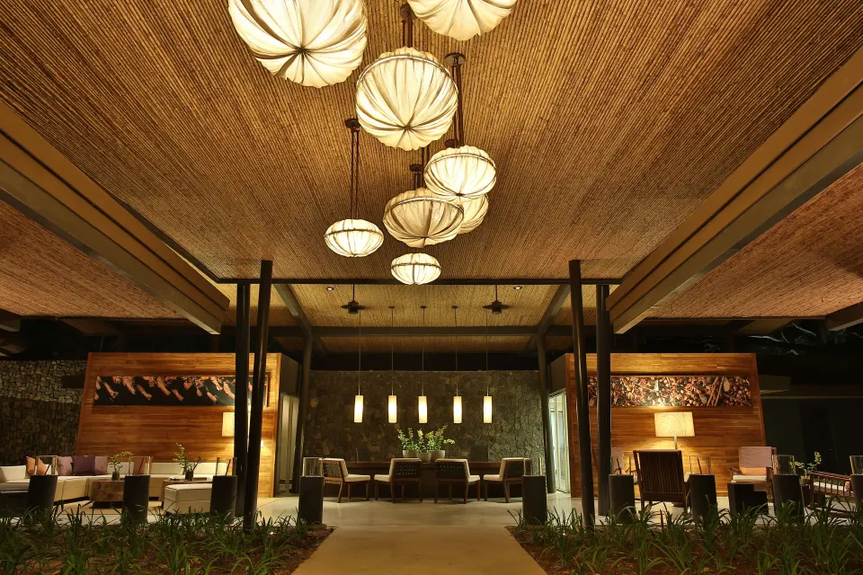 Lobby interior with illuminated lanterns and lounge seating at El Mangroove Papagayo