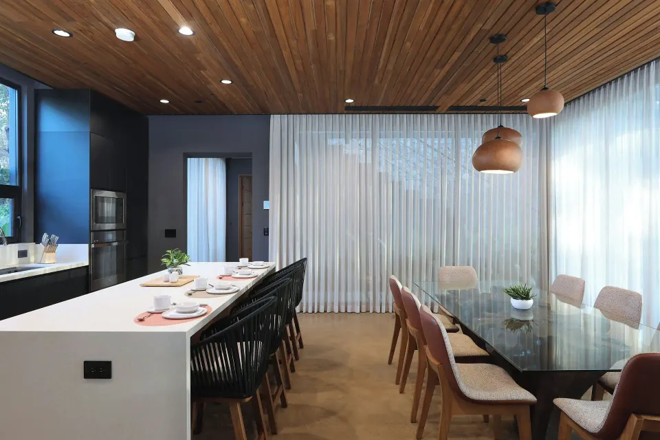 Contemporary dining table and kitchen island at El Mangroove Papagayo