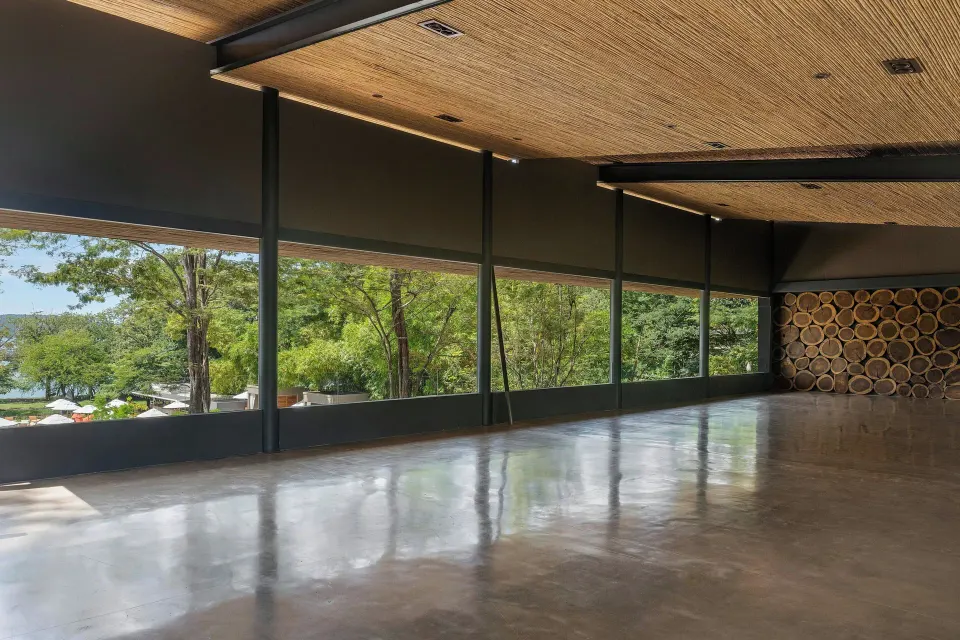 Spacious open event room with floor-to-ceiling windows at El Mangroove Papagayo