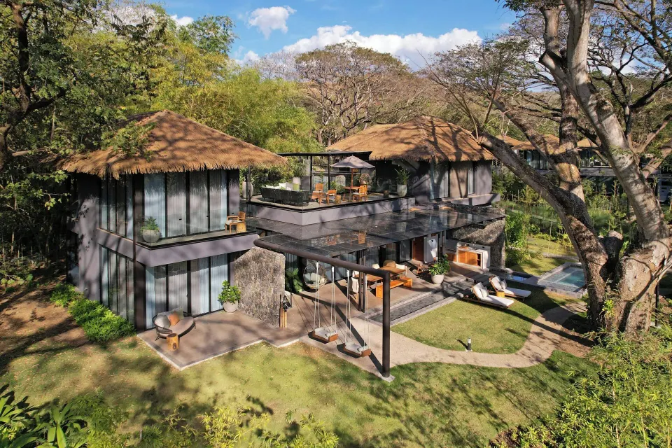 Rear exterior of the Balcony Garden three-bedroom villa with upper terrace and landscaping at El Mangroove Papagayo