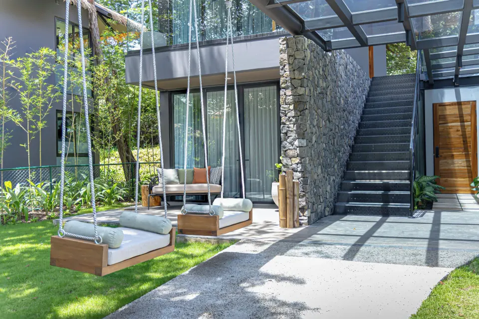Outdoor hanging daybeds and stairway outside Balcony Garden View Three-Bedroom Villa at El Mangroove Papagayo