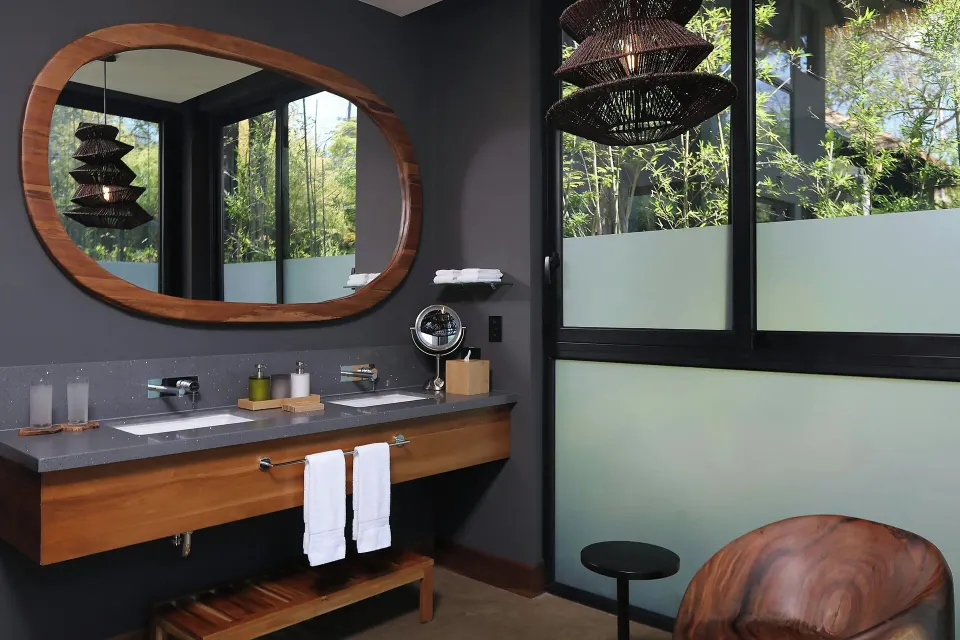 Vanity corner with window and wooden chair in Balcony Garden View Three-Bedroom Villa at El Mangroove Papagayo