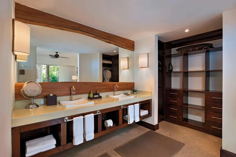 Double-sink vanity and open closet area in a Presidential with Sofa Bed Ocean View Suite at El Mangroove Papagayo