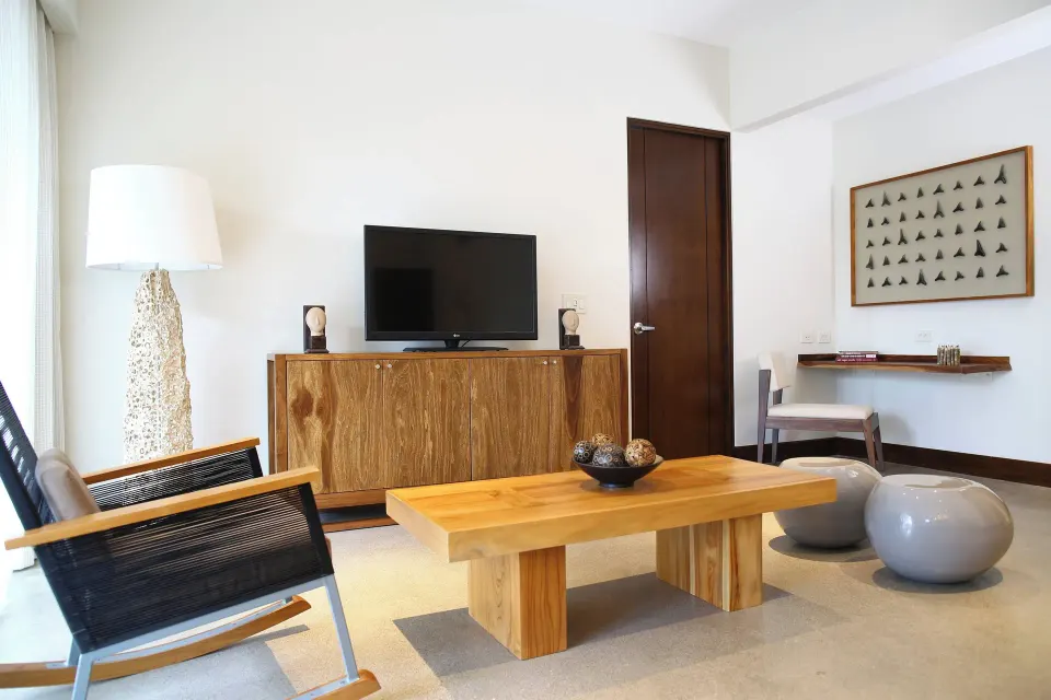 Media corner with TV, cabinet and seating in a Presidential Suite at El Mangroove Papagayo