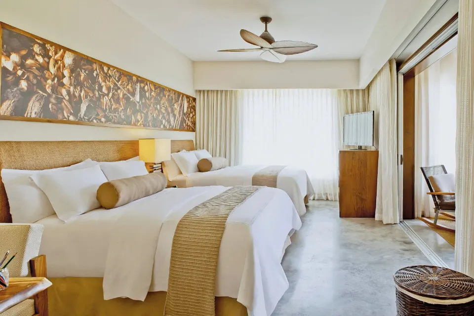 Resort View Suite twin beds and balcony at El Mangroove Papagayo