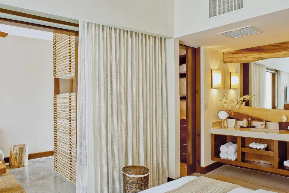 Resort View Suite bathroom vanity and closet at El Mangroove Papagayo