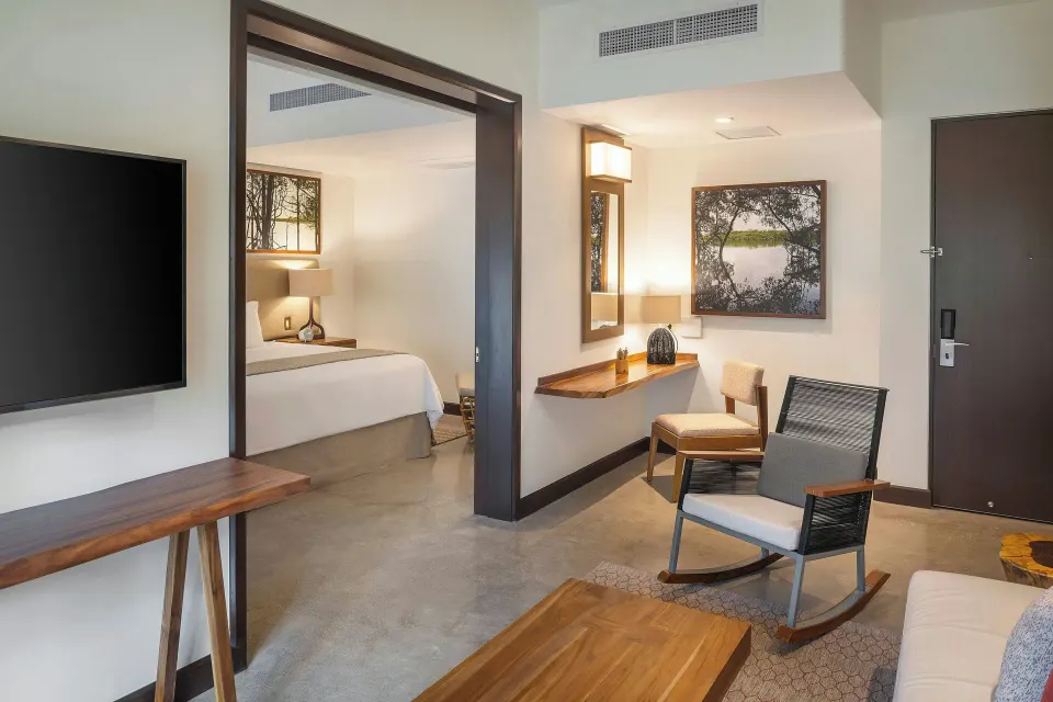 Suite interior showing living area and doorway into separate bedroom at El Mangroove Papagayo