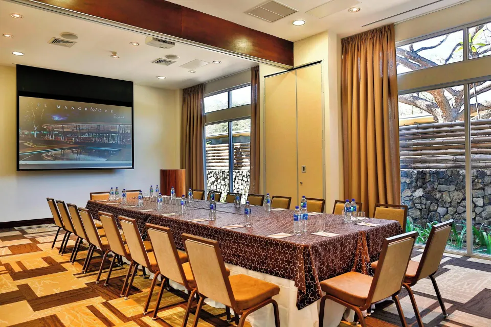 Conference room set up with a boardroom table at El Mangroove Papagayo