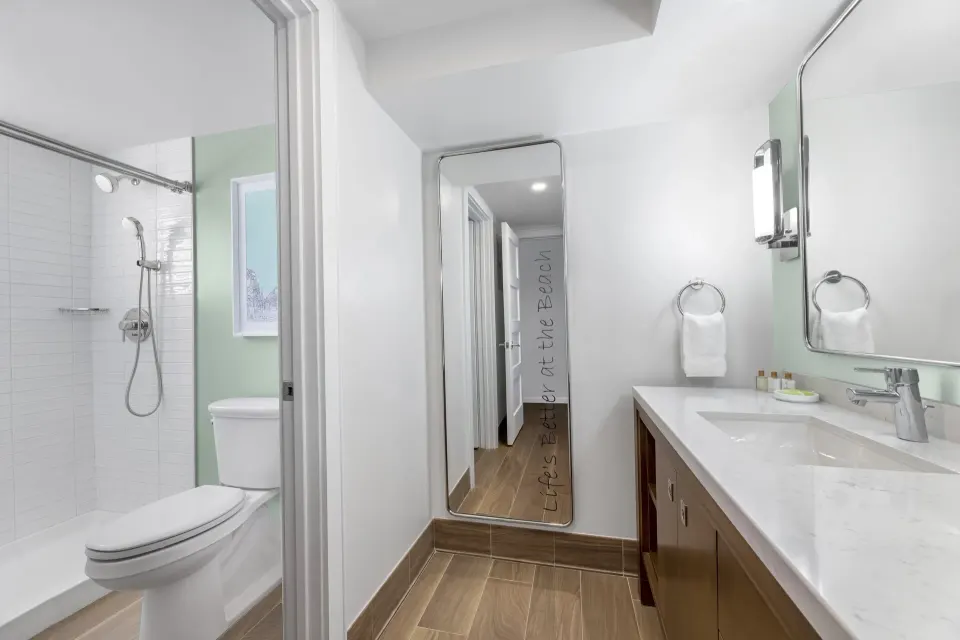 Standard Studio bathroom vanity and shower at Elysian Beach Resort.