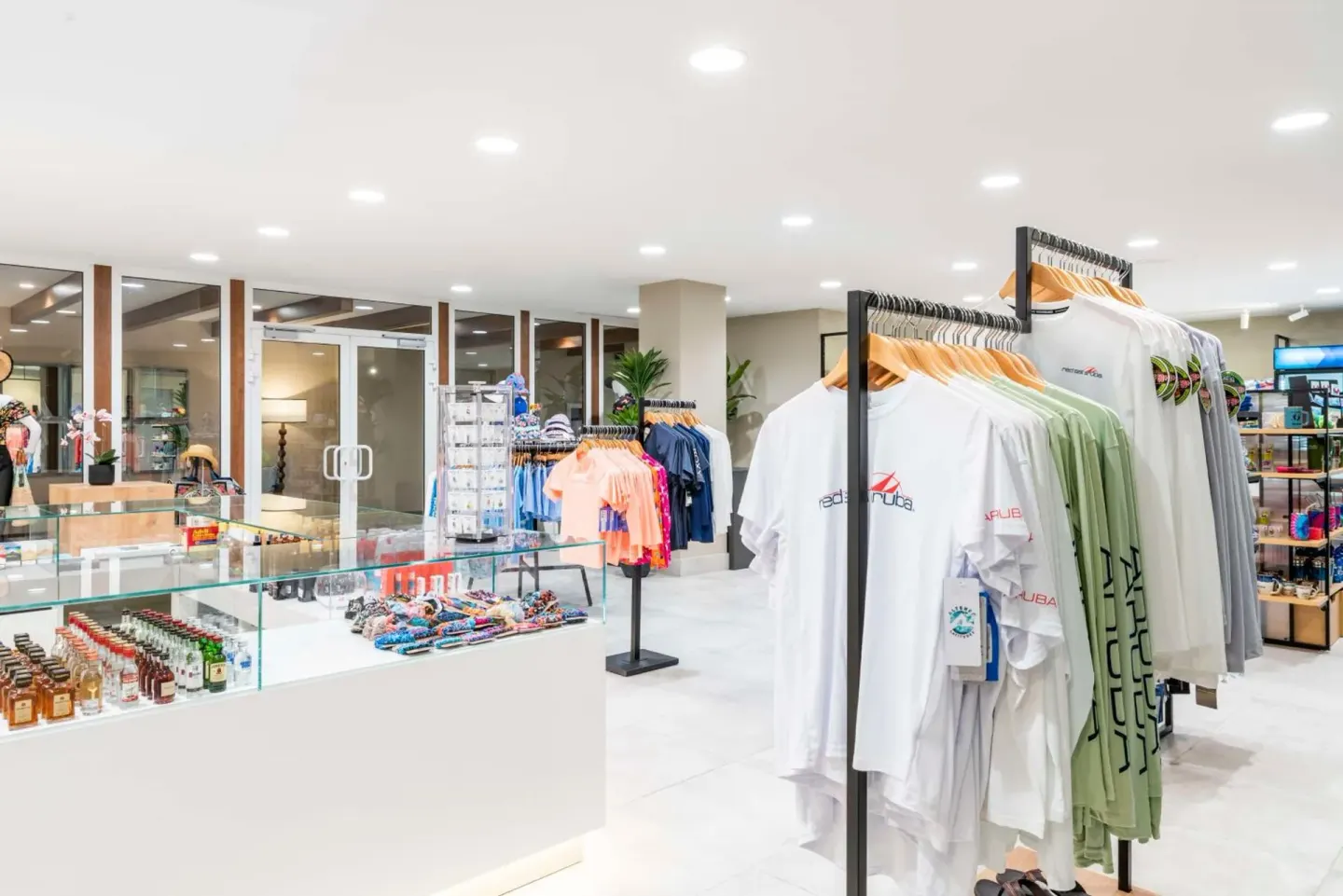 Bright resort shop with clothing racks and souvenirs at Embassy Suites Aruba Beach Resort.