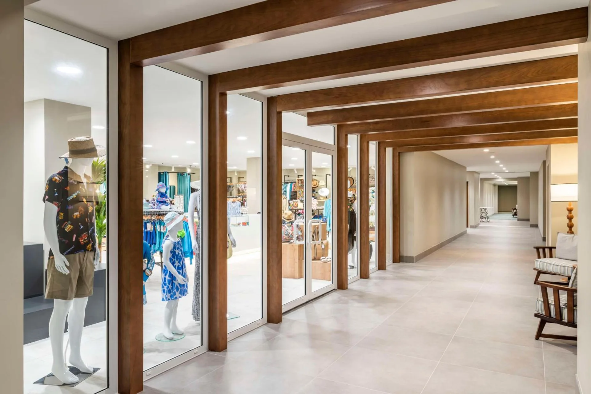 Resort corridor with shop windows and mannequins at Embassy Suites Aruba Beach Resort.
