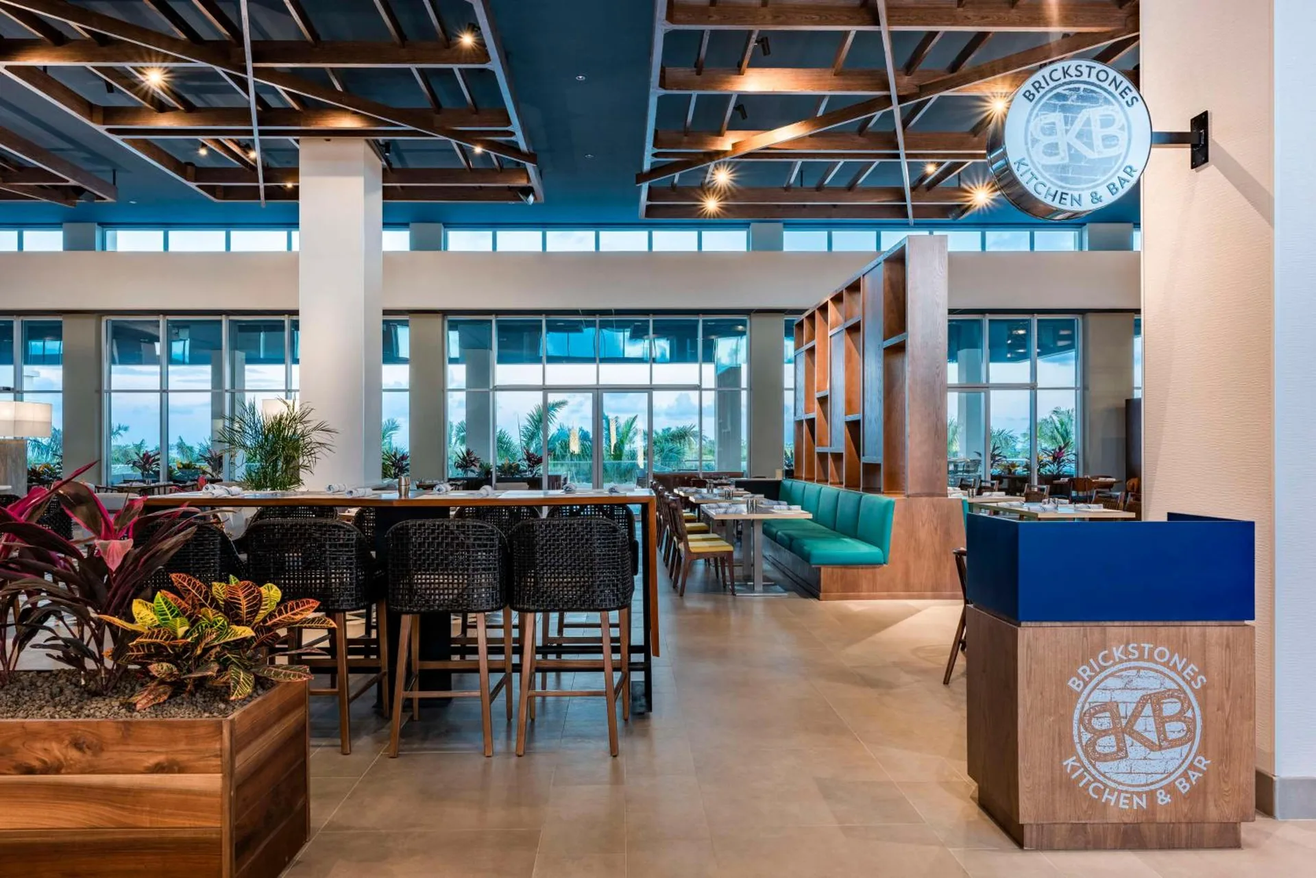 Brickstones dining area and bar seating at Embassy Suites Aruba Beach Resort.