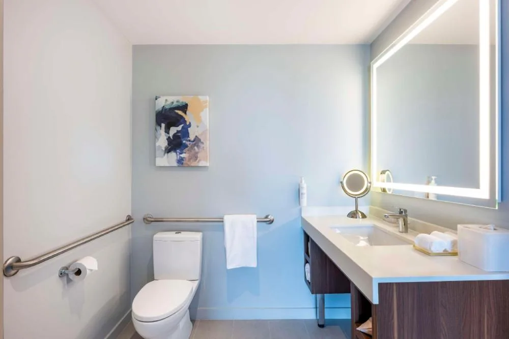 Accessible bathroom vanity and grab bars at Embassy Suites Aruba Beach Resort.