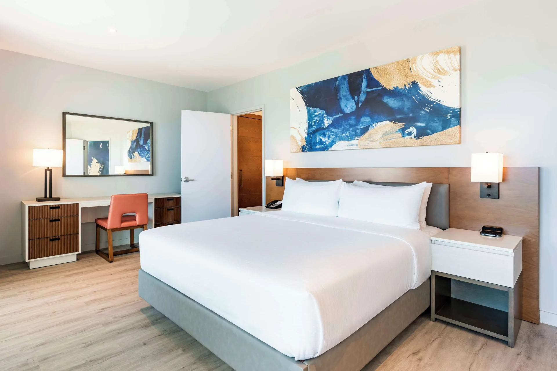 Oceanfront one-bedroom room with king bed at Embassy Suites Aruba Beach Resort.