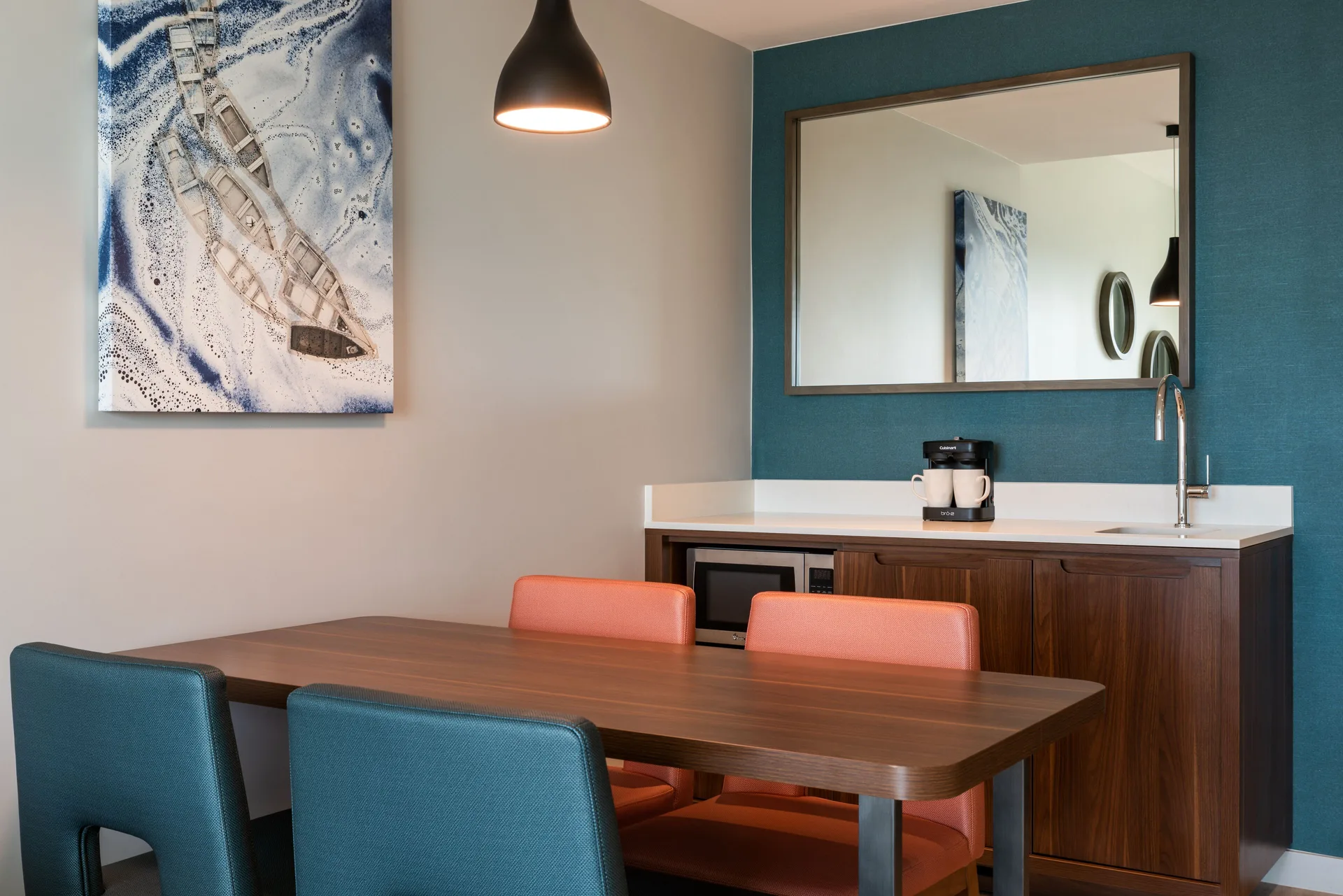 Dining table and wet bar in a suite at Embassy Suites Aruba Beach Resort.