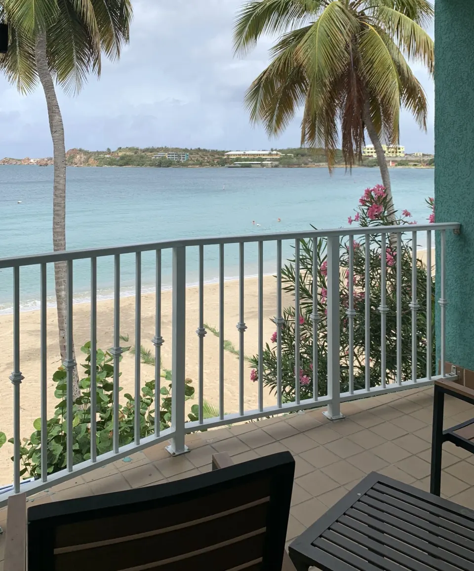 Beachfront Premium balcony with ocean and palm view at Emerald Beach Resort.