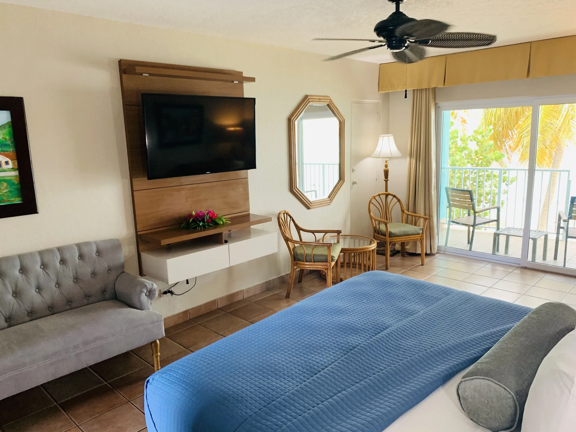Beachfront Premium Room with bed, seating, TV, and balcony at Emerald Beach Resort.