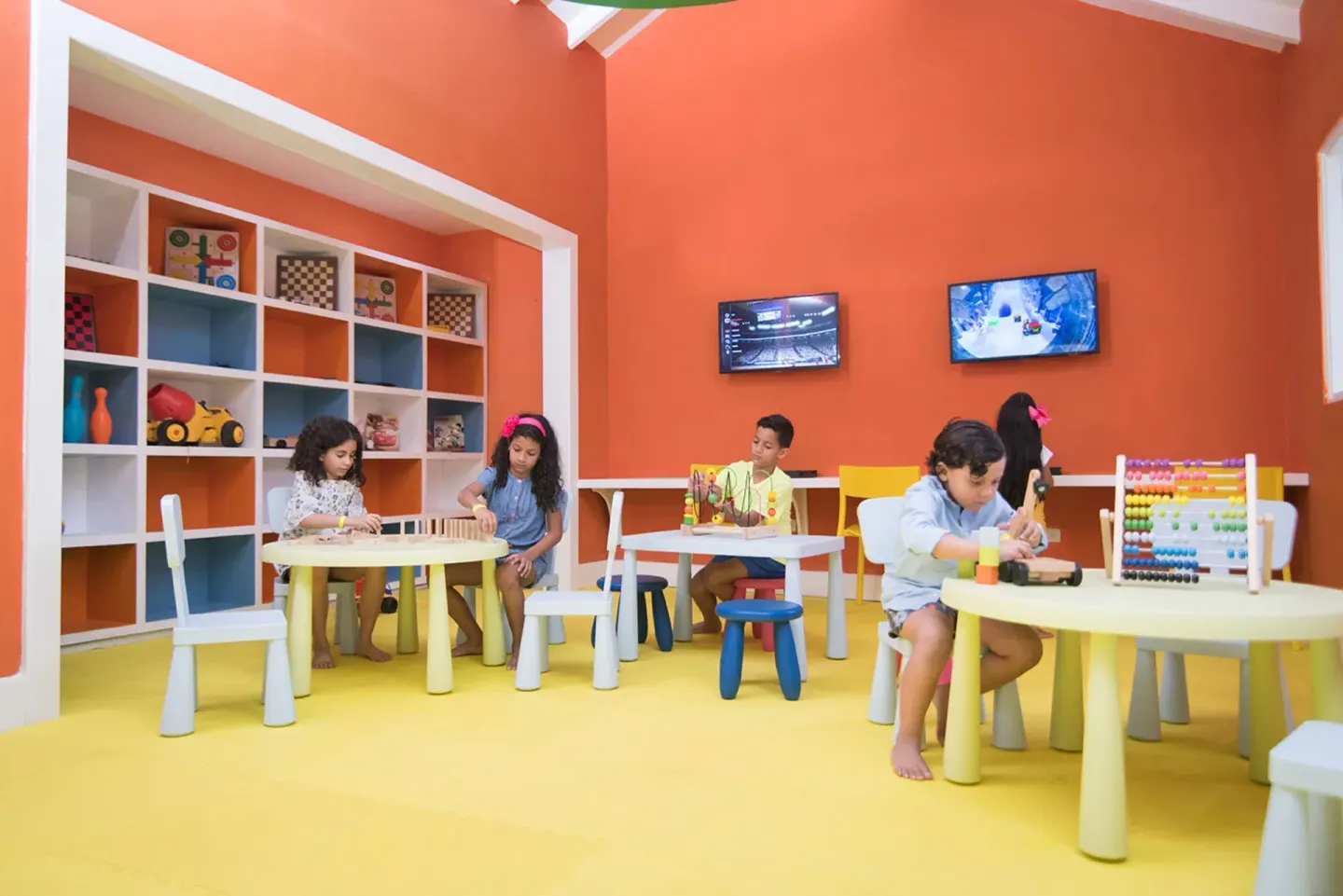 Children's activity room with toys and play tables at Emotions by Hodelpa Puerto Plata.