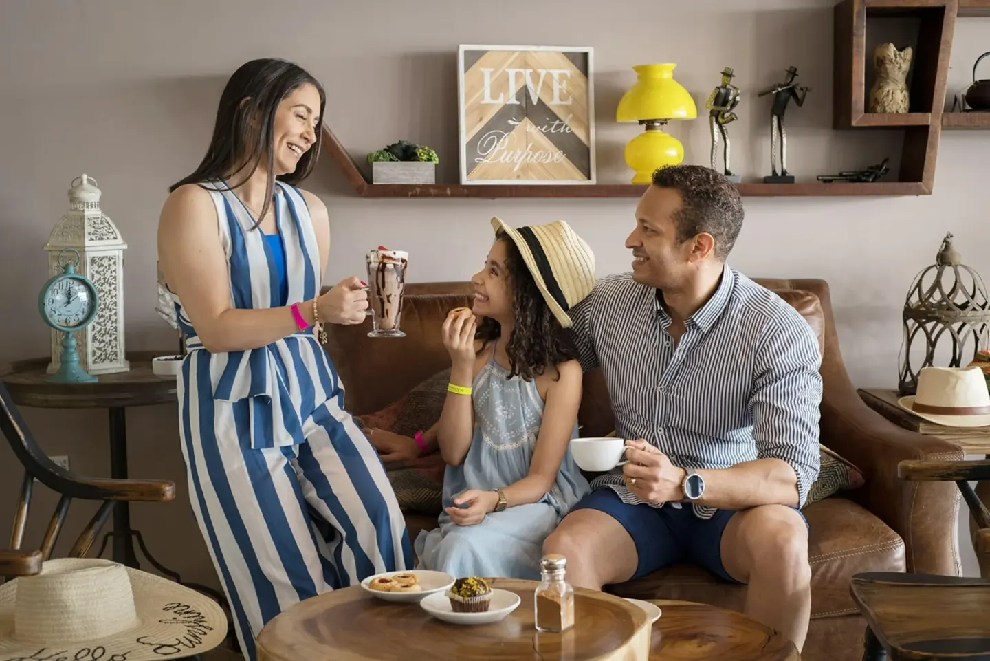 Family enjoying desserts in a lounge at Emotions by Hodelpa Puerto Plata.