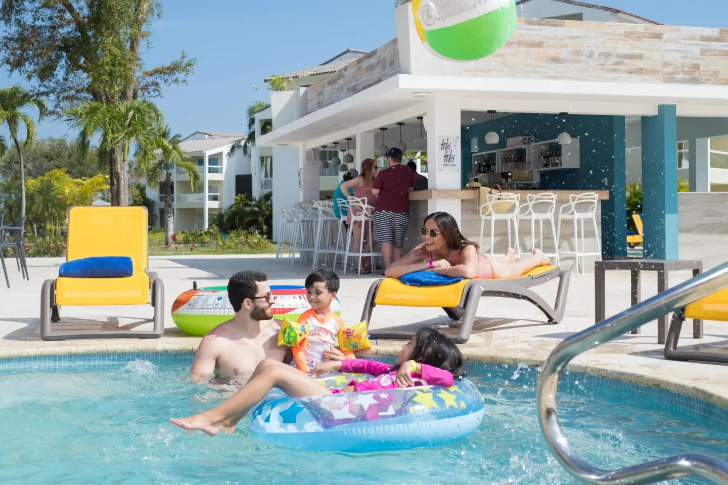 Family pool area with swim-up bar at Emotions by Hodelpa Puerto Plata.