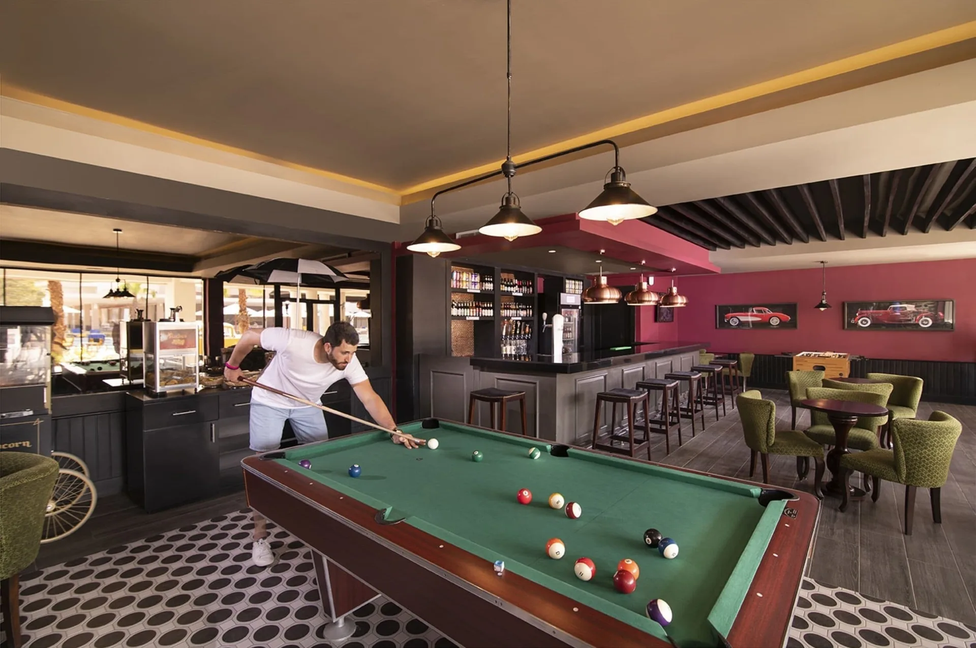 Billiards table and bar seating at Emotions by Hodelpa Puerto Plata.