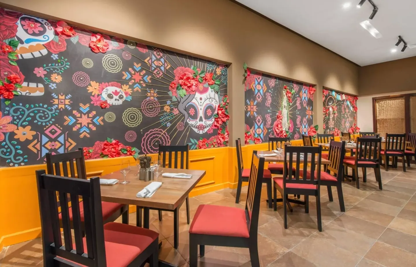 Lolita dining room with colorful skull murals at Emotions by Hodelpa Puerto Plata.