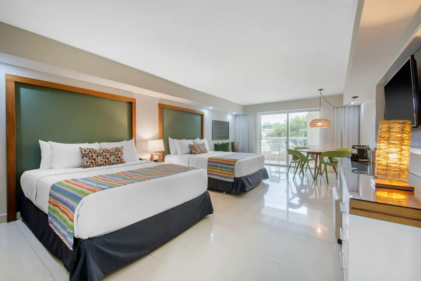 Family Deluxe room with two beds and balcony at Emotions by Hodelpa Puerto Plata.