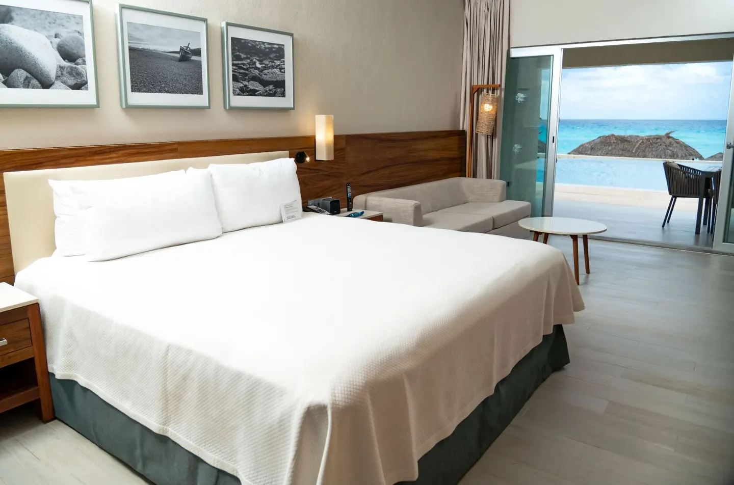 Swim Up Oceanfront Only Adults room with king bed and ocean-facing terrace at Emporio Cancun.