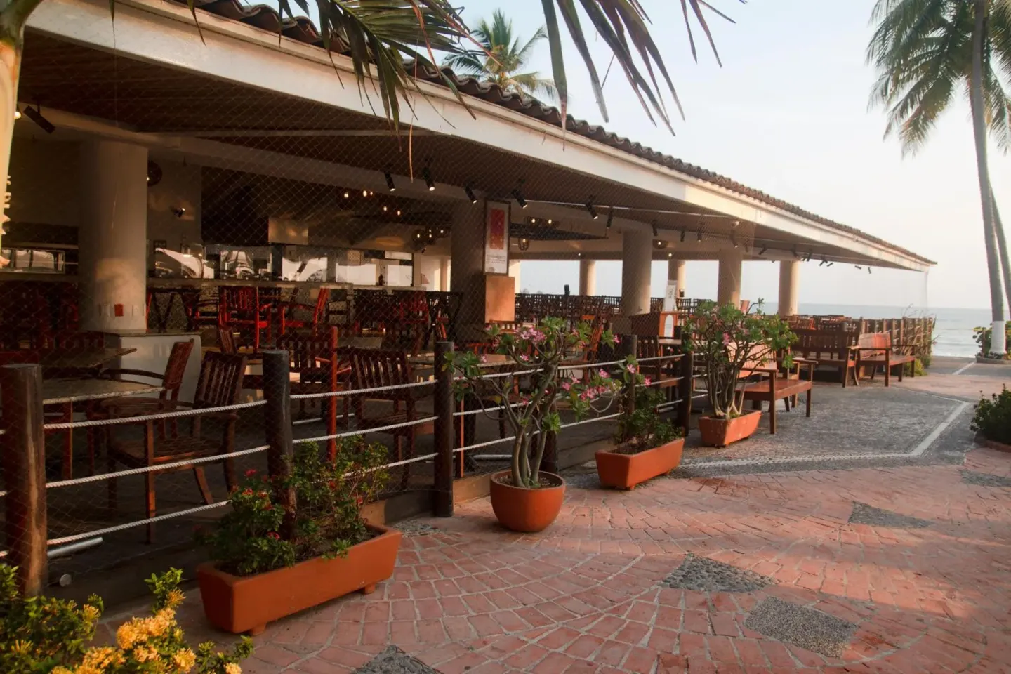 Open-air dining terrace with oceanfront seating at Emporio Ixtapa.