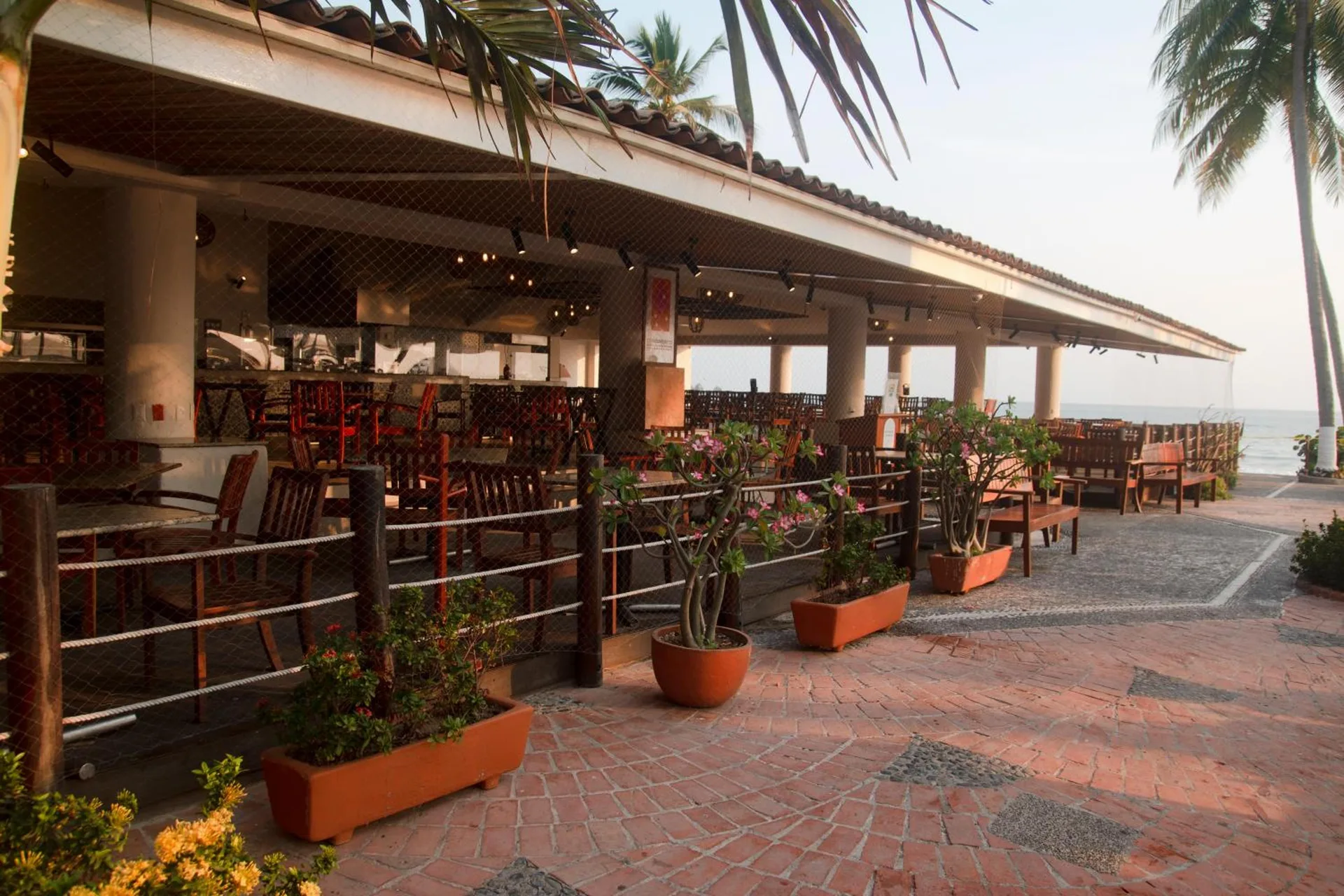 Open-air dining terrace with oceanfront seating at Emporio Ixtapa.