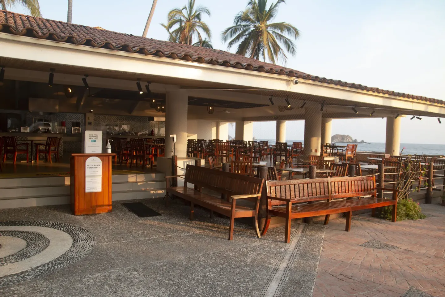 Exterior of an open-air restaurant beside the beach at Emporio Ixtapa.