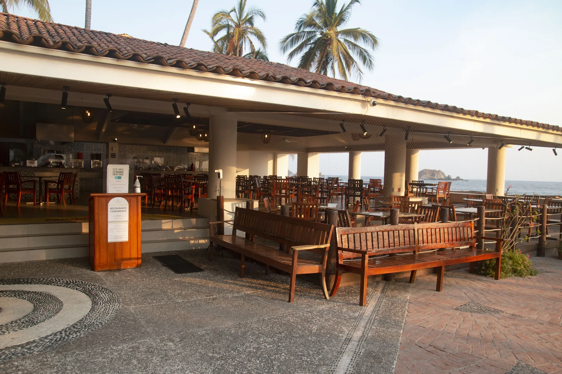 Exterior of an open-air restaurant beside the beach at Emporio Ixtapa.