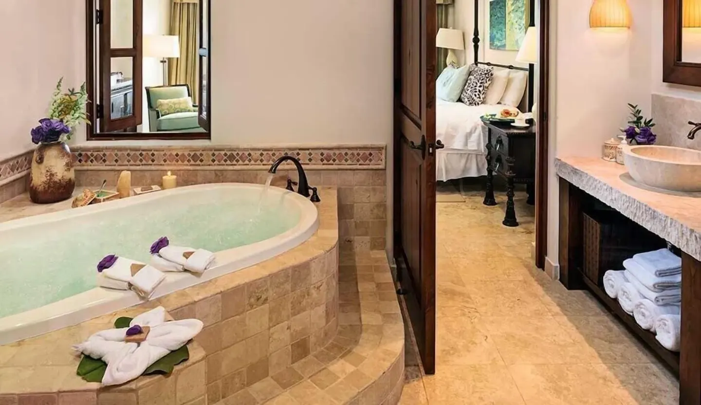 Bathroom with soaking tub, vanity and bedroom doorway at Esperanza.