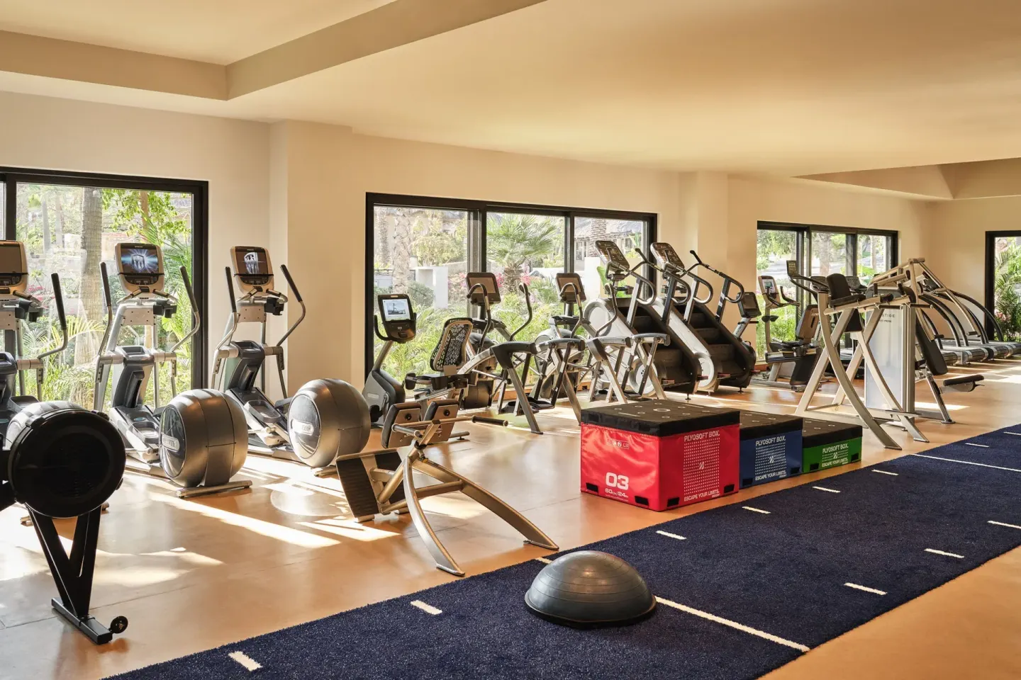Fitness center with cardio machines and training equipment at Esperanza.